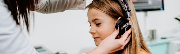 young girl undergoing a hearing test