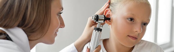 kid getting an ear exam