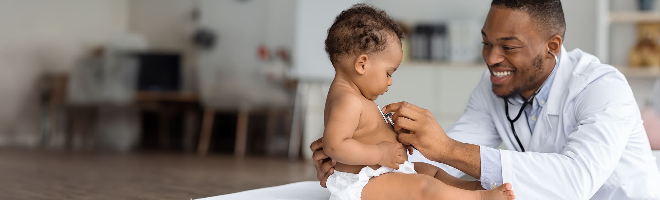 doctor checking a babies heartbeat