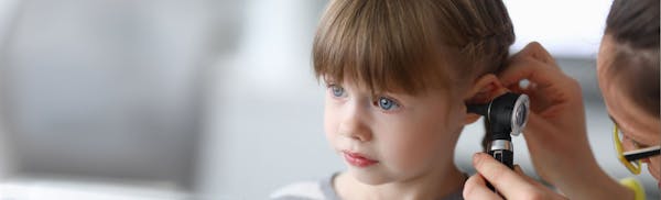 kid getting an ear exam