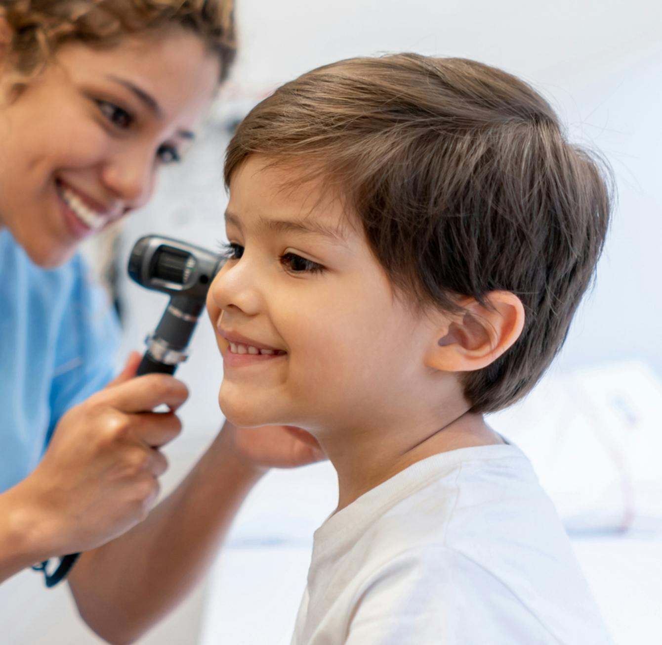 young boy getting an ear exam