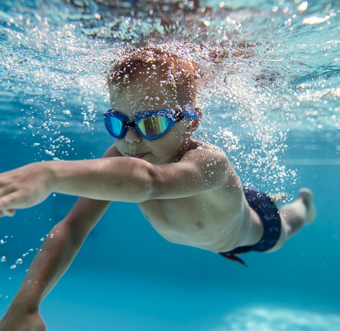 young boy swimming