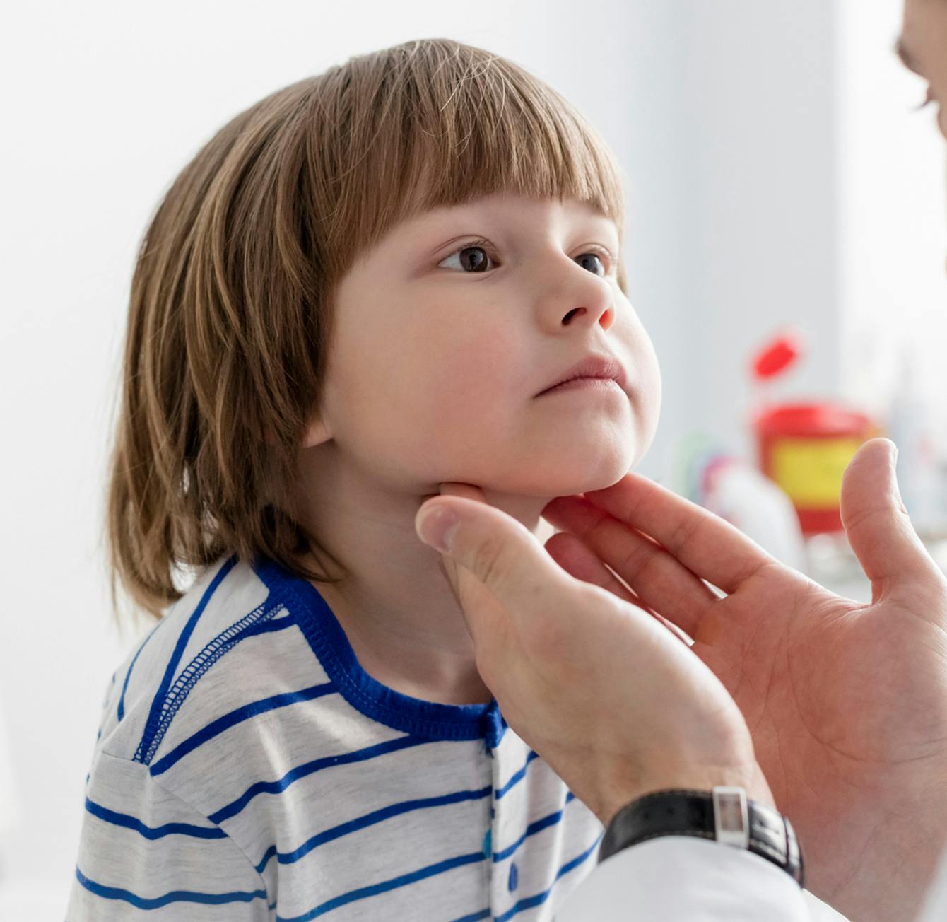 doctor checking a kids tonsils