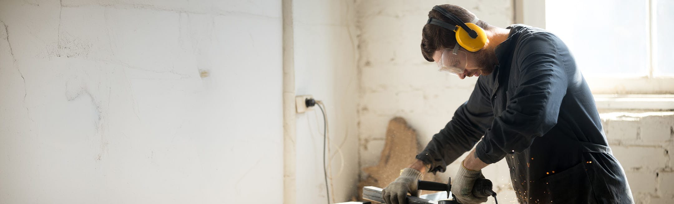 man using a saw