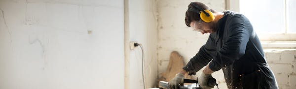 man using a saw