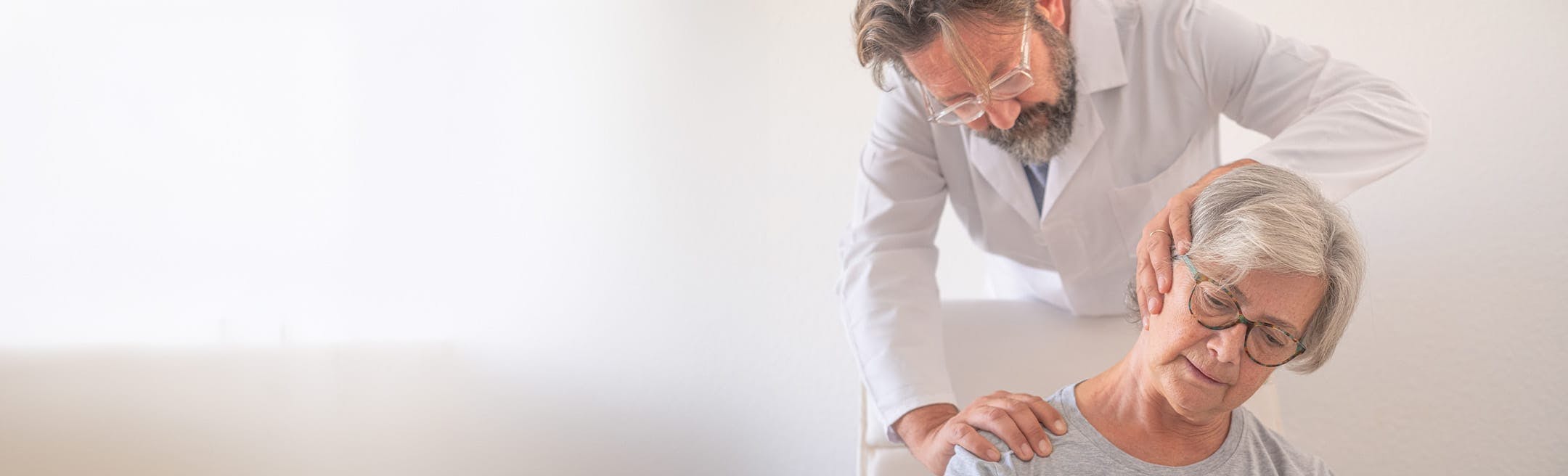 doctor stretching a patient's neck