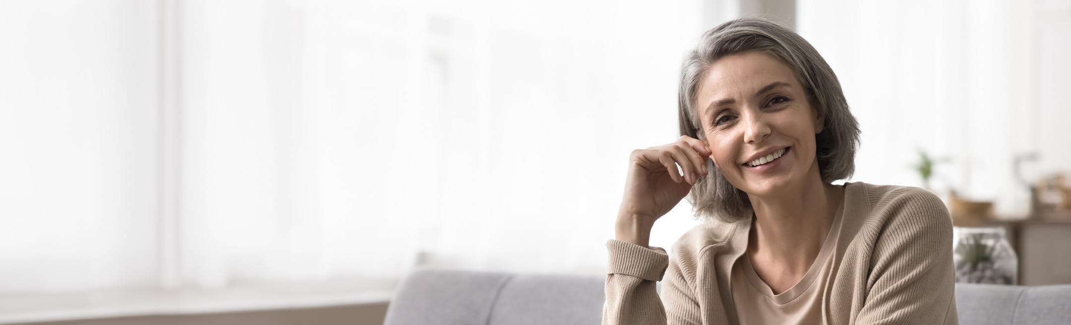 woman with a short greyish bob haircut