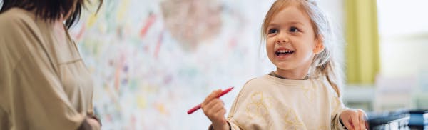 toddler girl wearing hearing aids