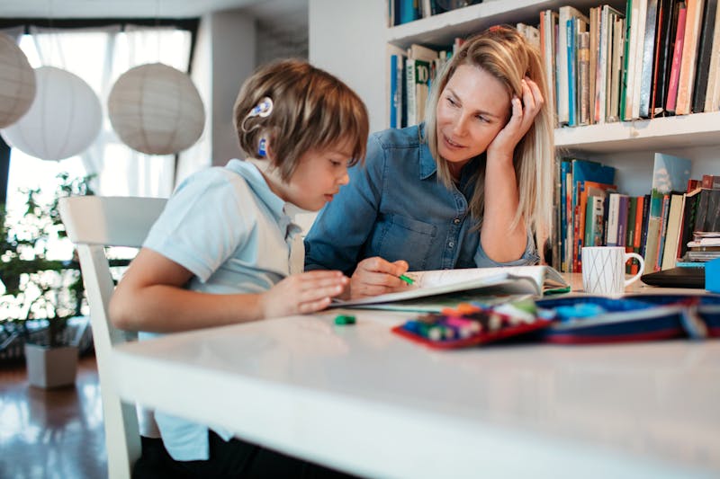 child with cochlear implant doing homework