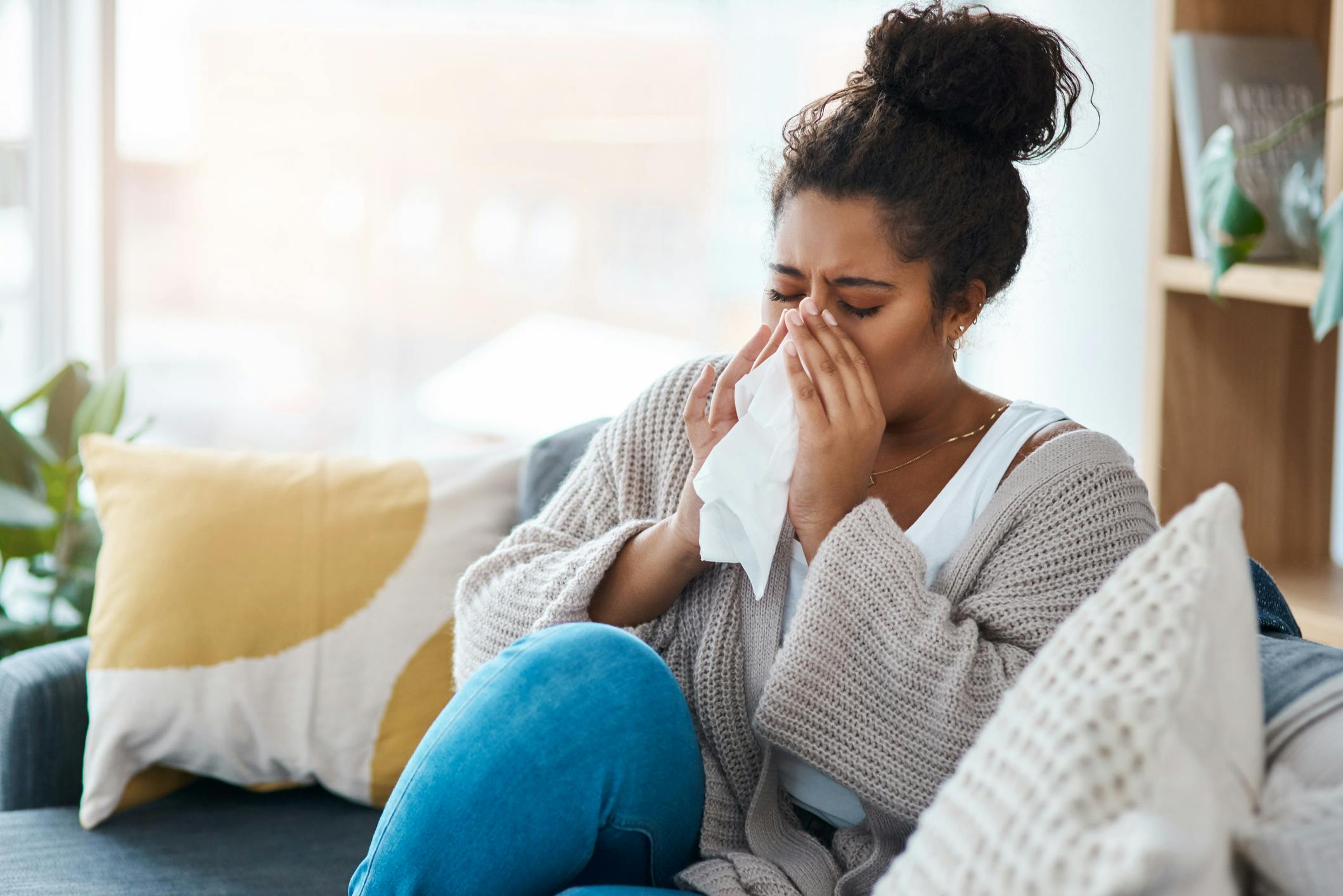 woman blowing nose