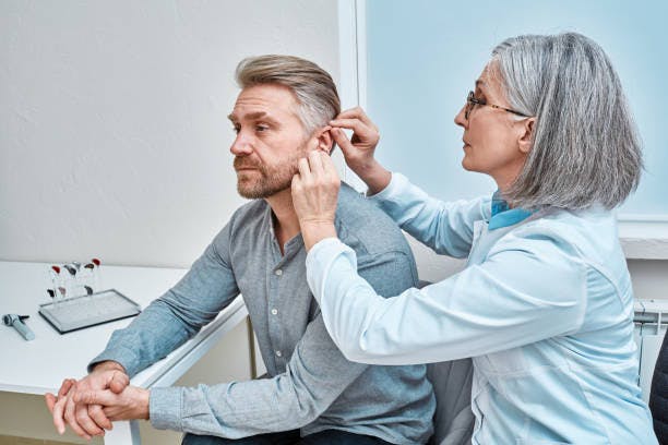 Man Getting a Hearing Aid
