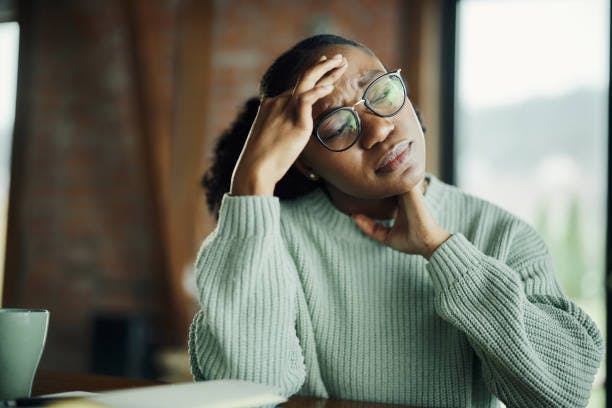 Woman with a Migraine