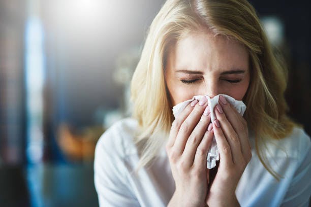 Woman Blowing Her Nose