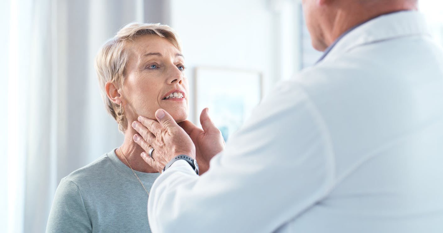 women receiving throat exam