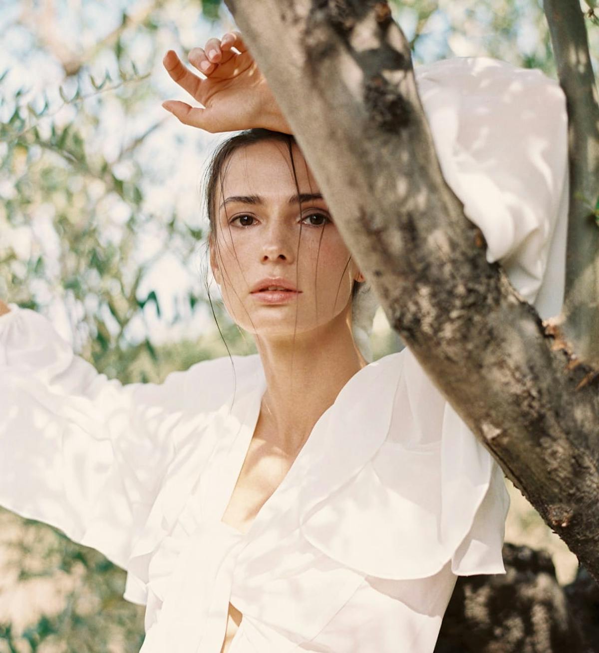 woman wearing a flowy white top