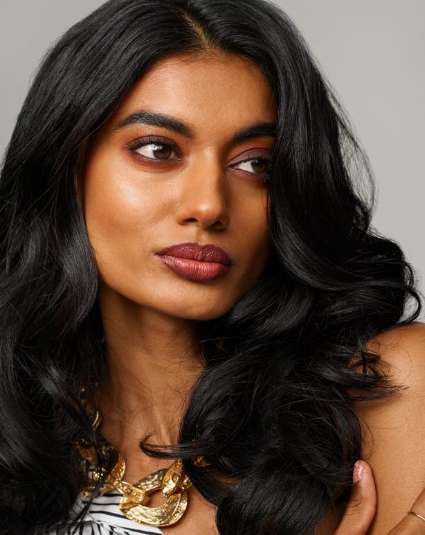 woman with long dark curly hair