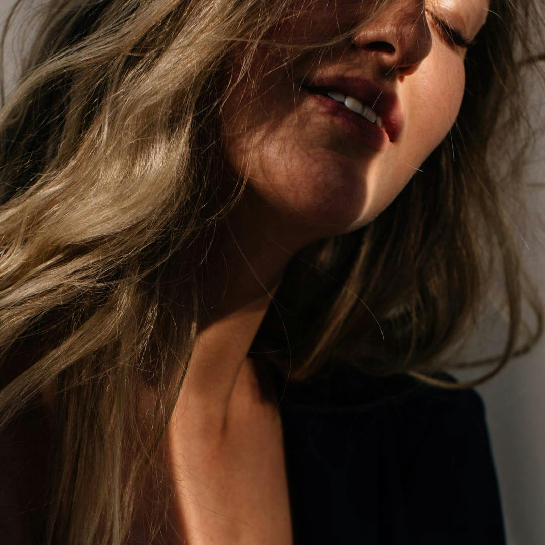 woman with eyes closed