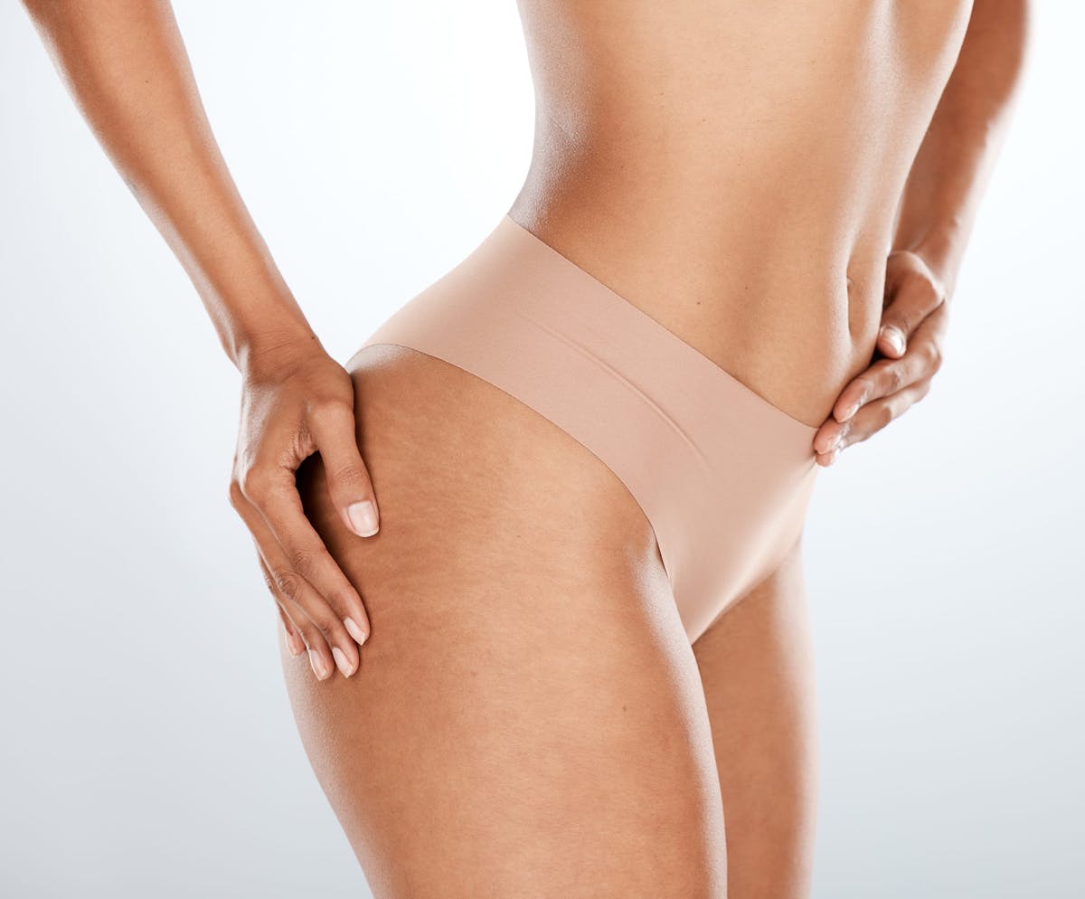 Woman's hip in tan underwear