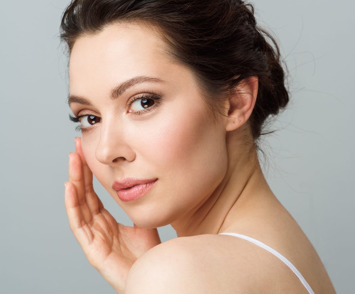 Woman smiling over shoulder