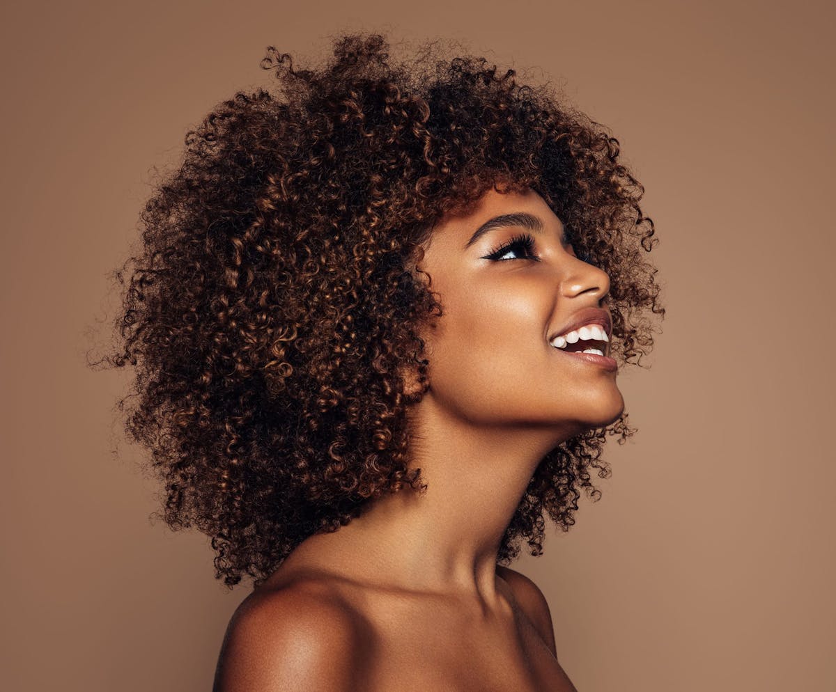 Smiling woman with curly hair
