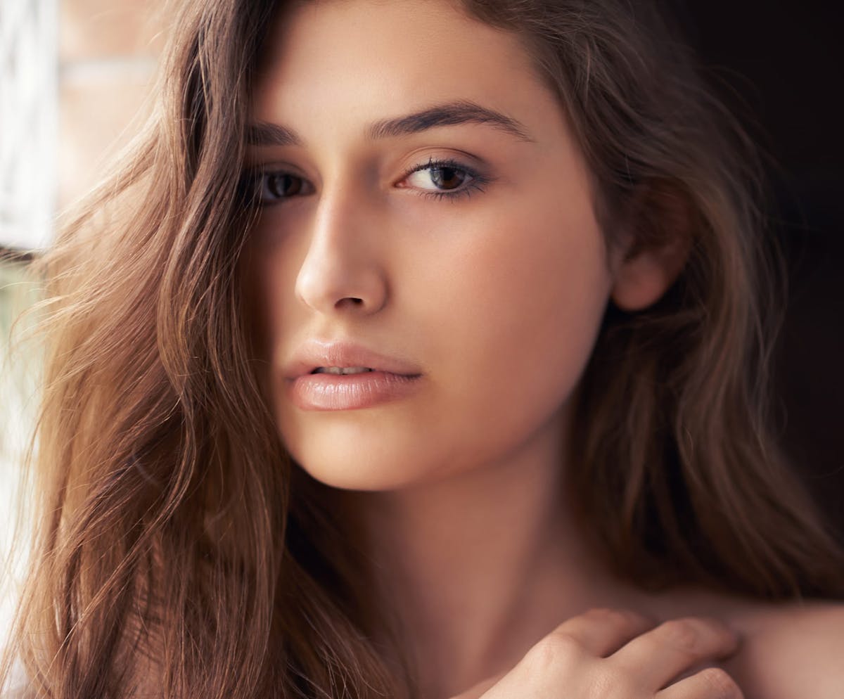 Woman with wavy brown hair