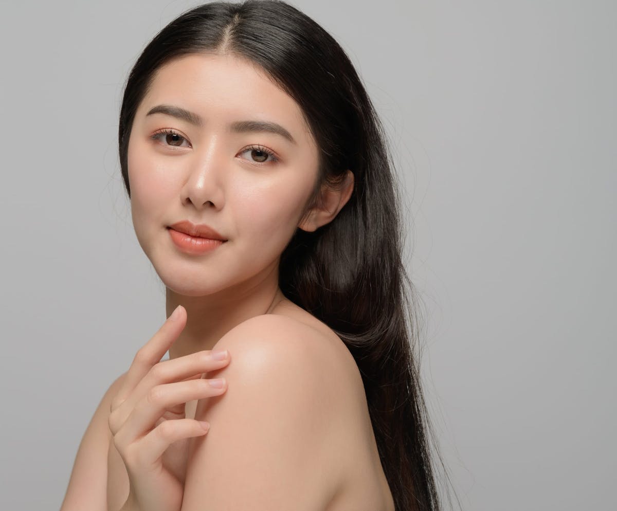 Woman smiling over shoulder