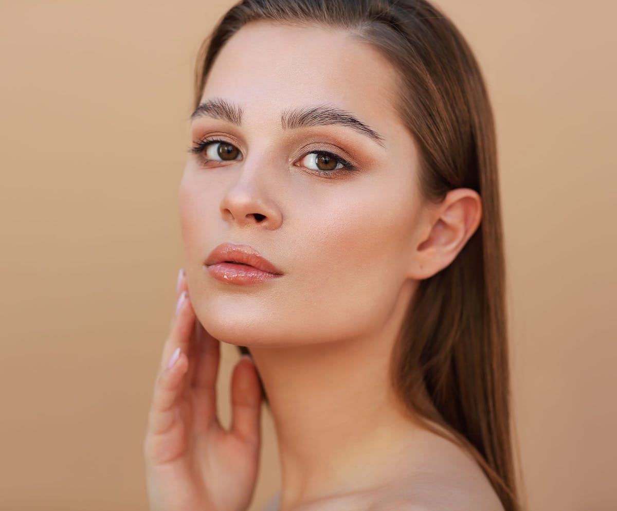 Woman touching her cheek