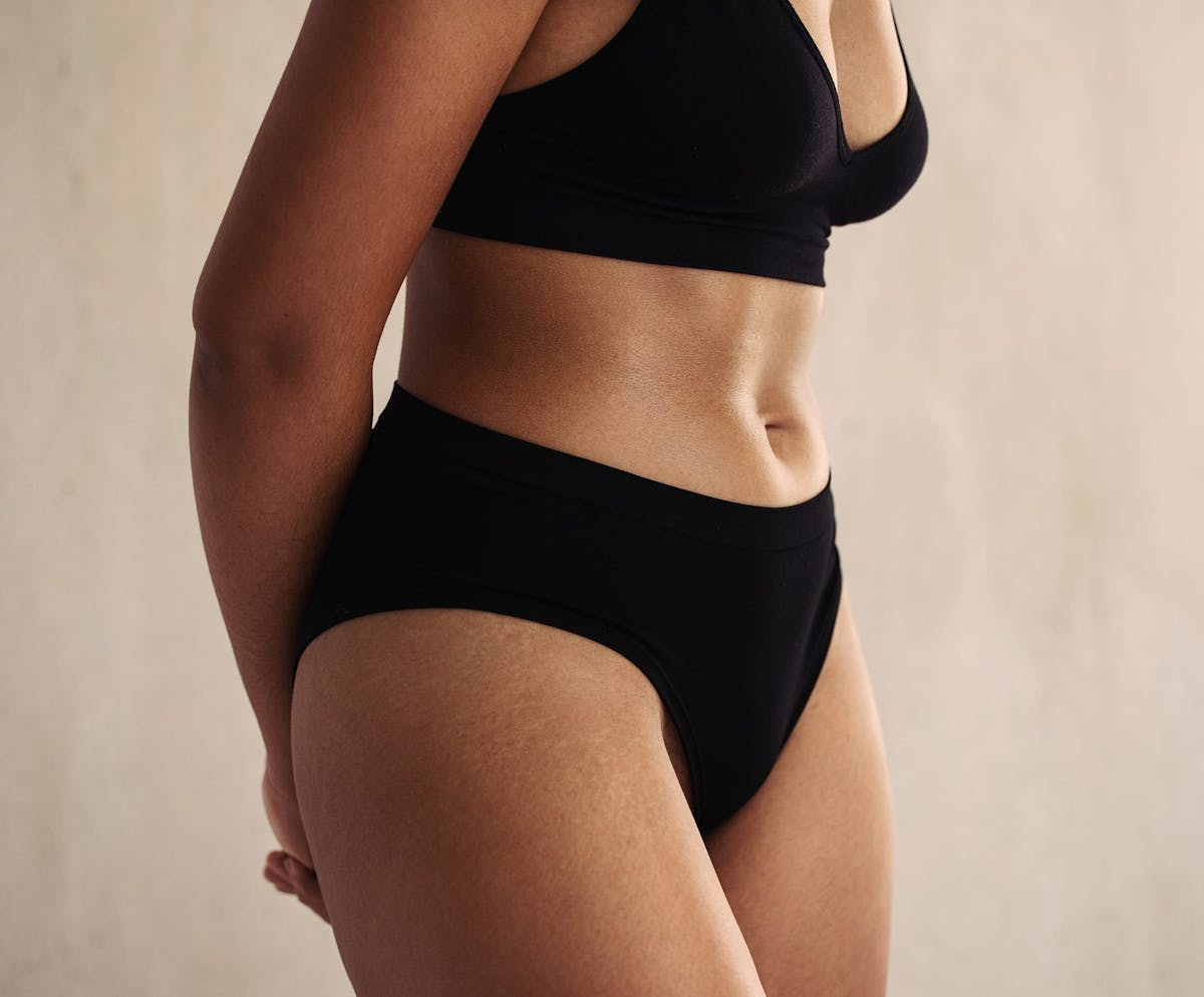 woman posing in black underwear