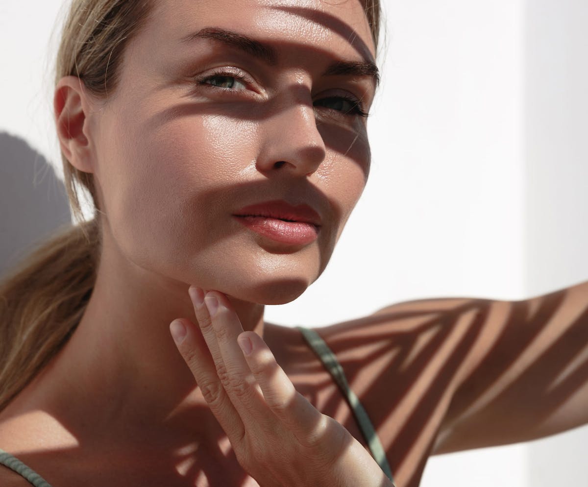 Woman posing under shadow
