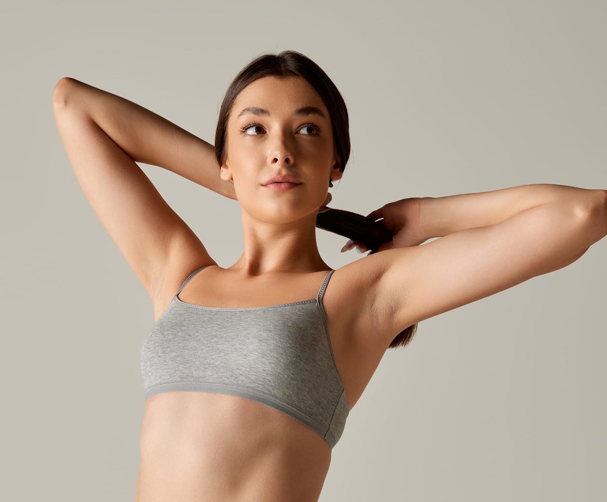 Woman tying hair back