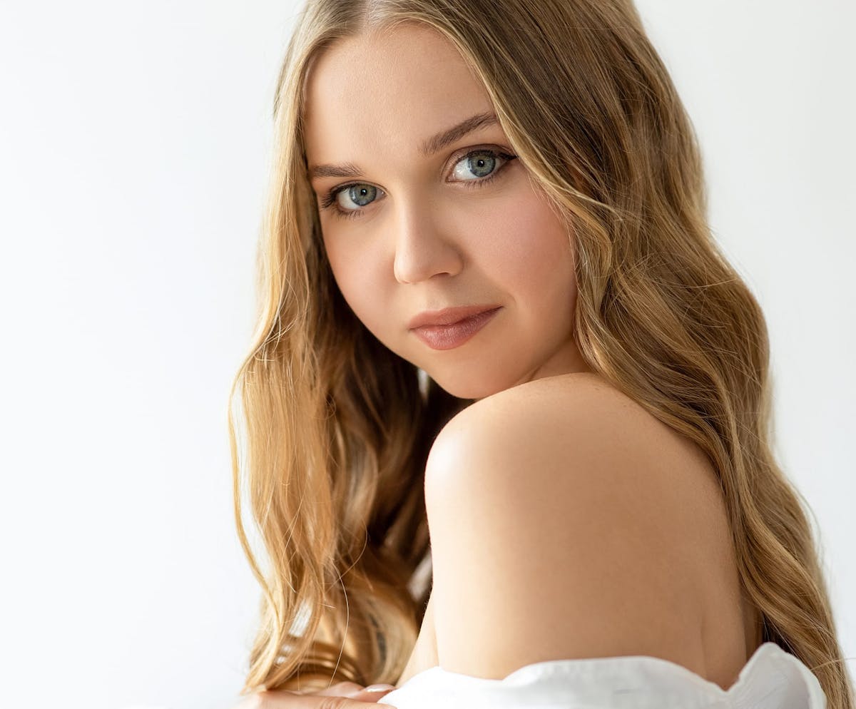 Woman smiling over shoulder