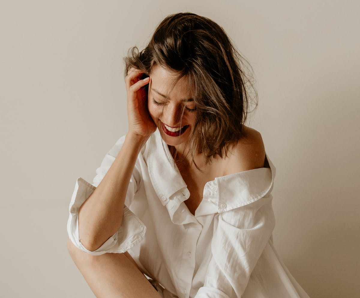 Woman smiling and glancing down