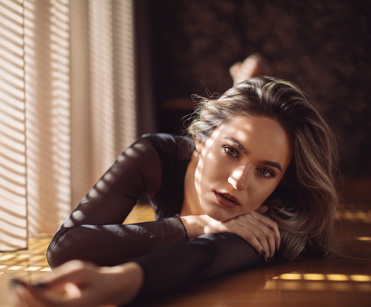 Woman posing in warm room
