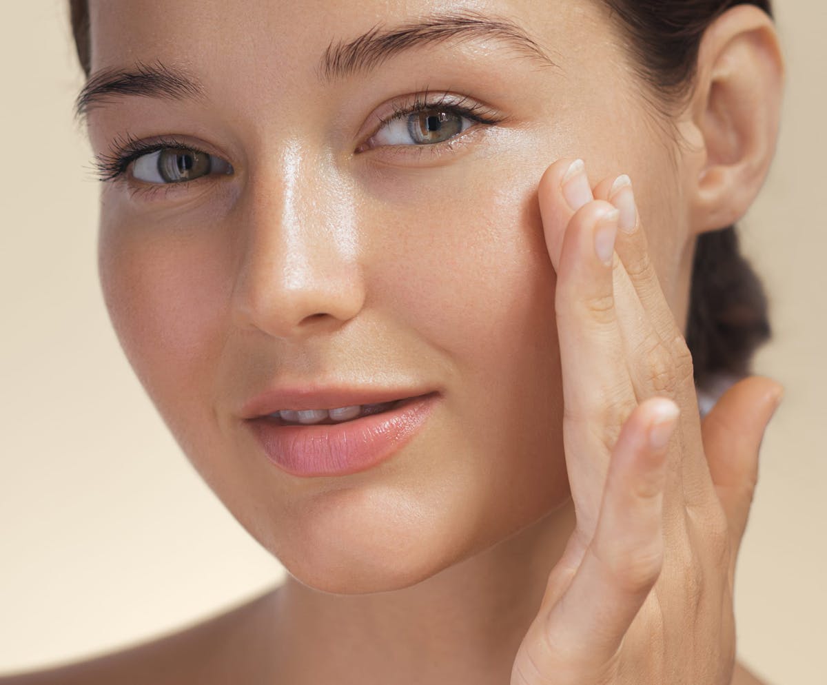 Woman touching cheek