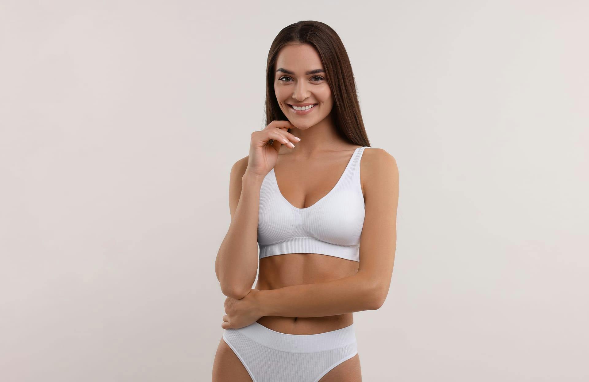 woman posing in white undergarments