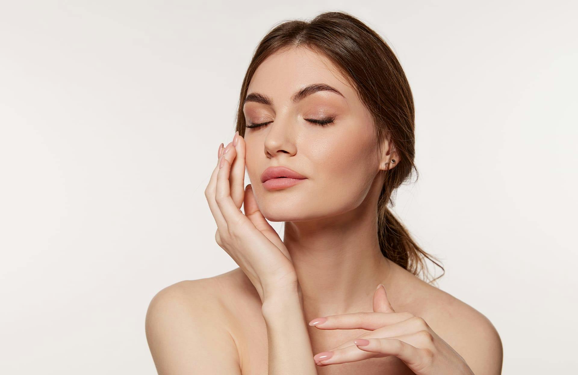 Woman touching face