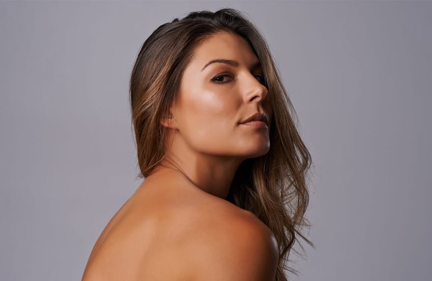 Woman glancing over shoulder