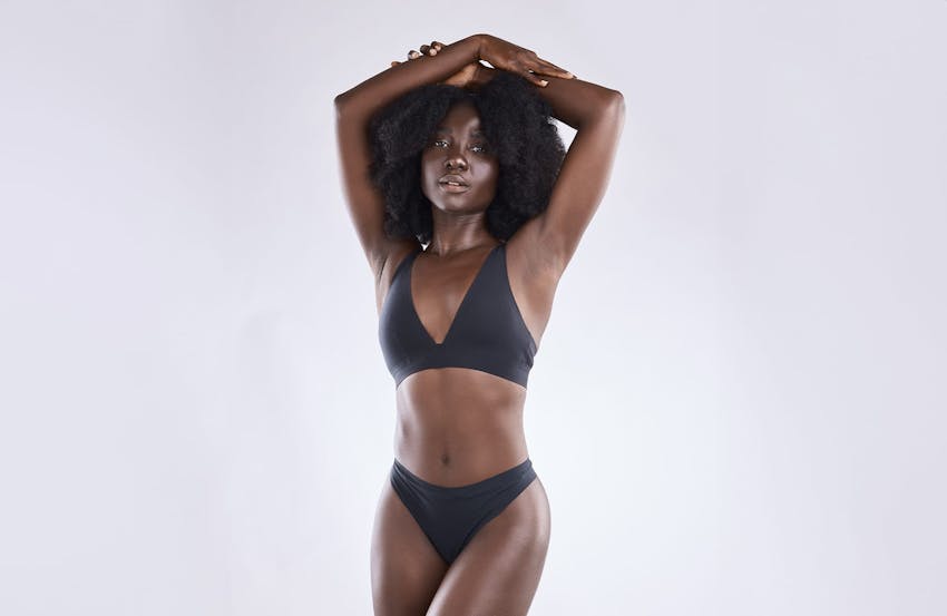 woman posing in black undergarments