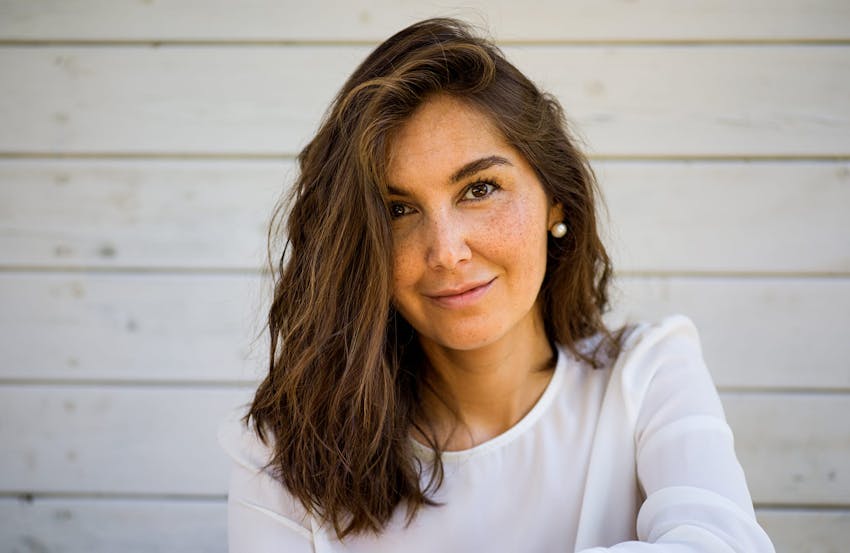 Freckled woman smiling
