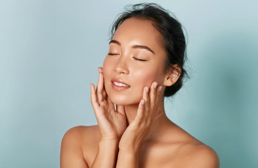 Woman feeling cheeks