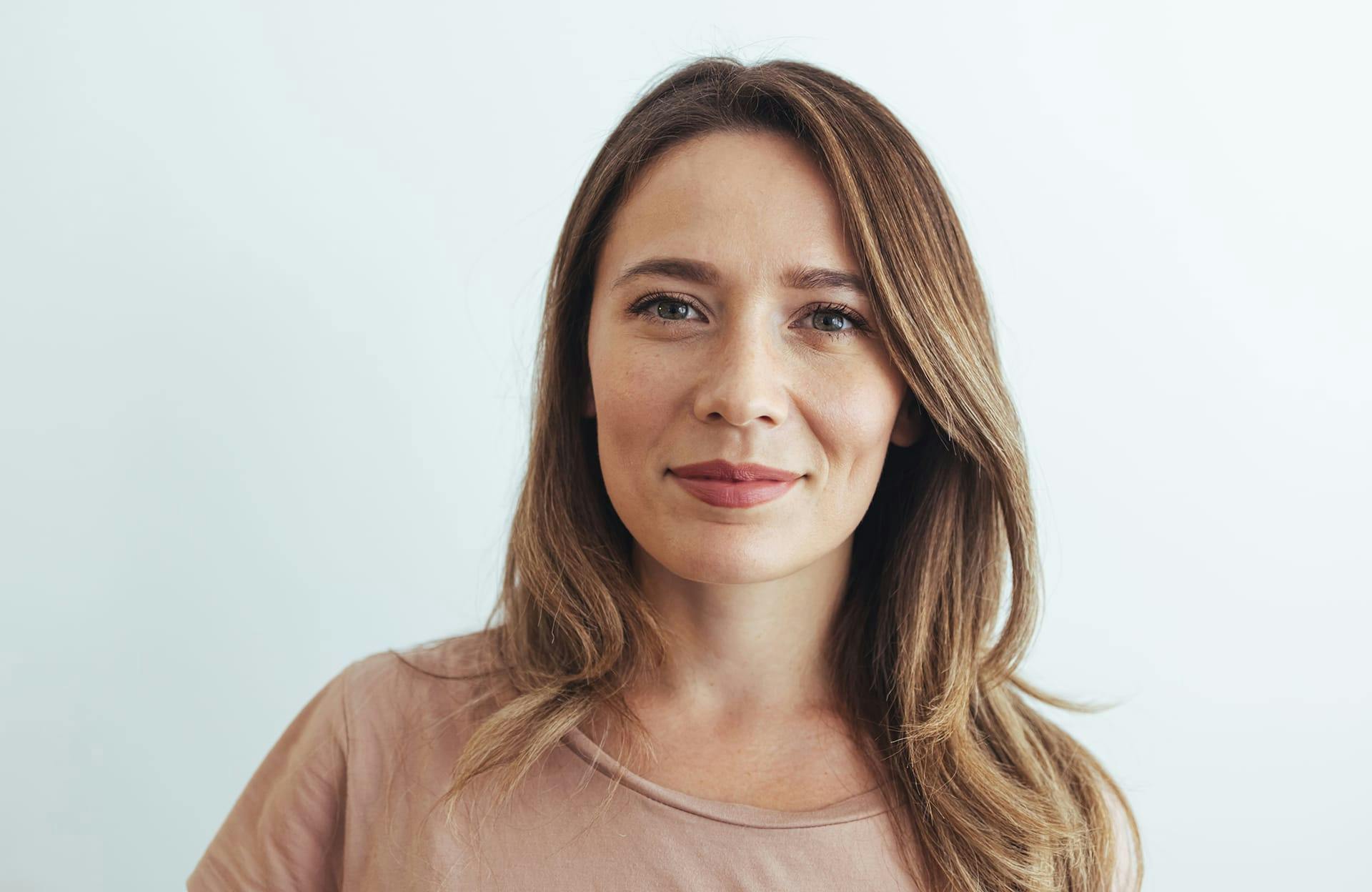 Woman in tan shirt