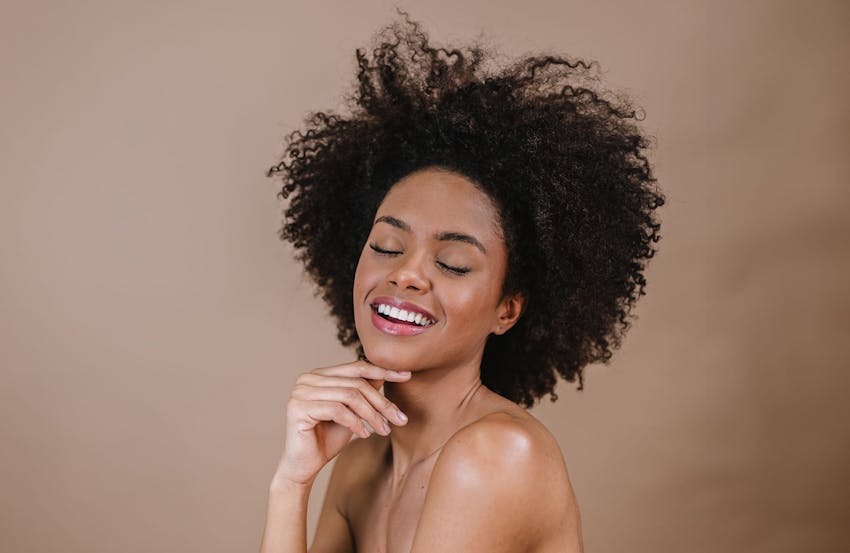Smiling woman with curly hair