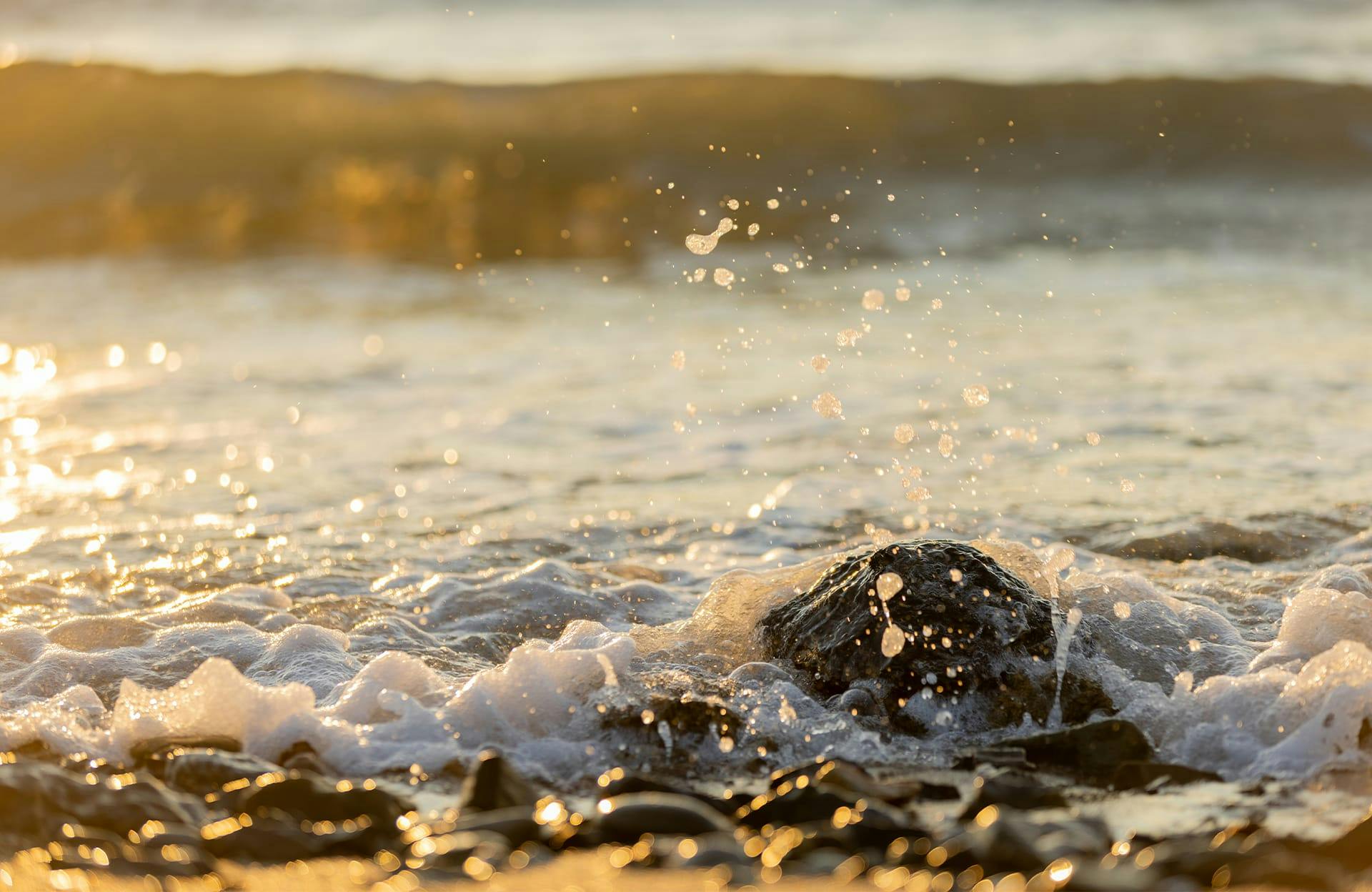 Ocean flowing over rocky beach