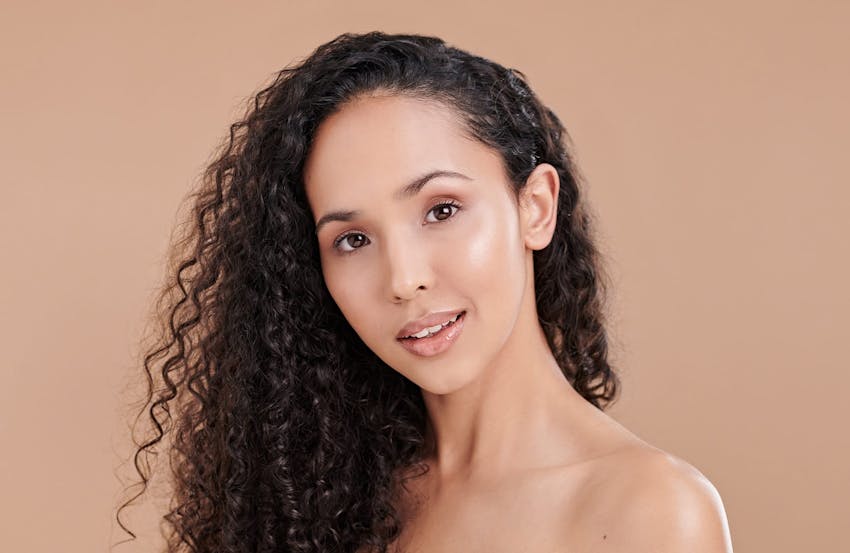 Woman with curly brown hair