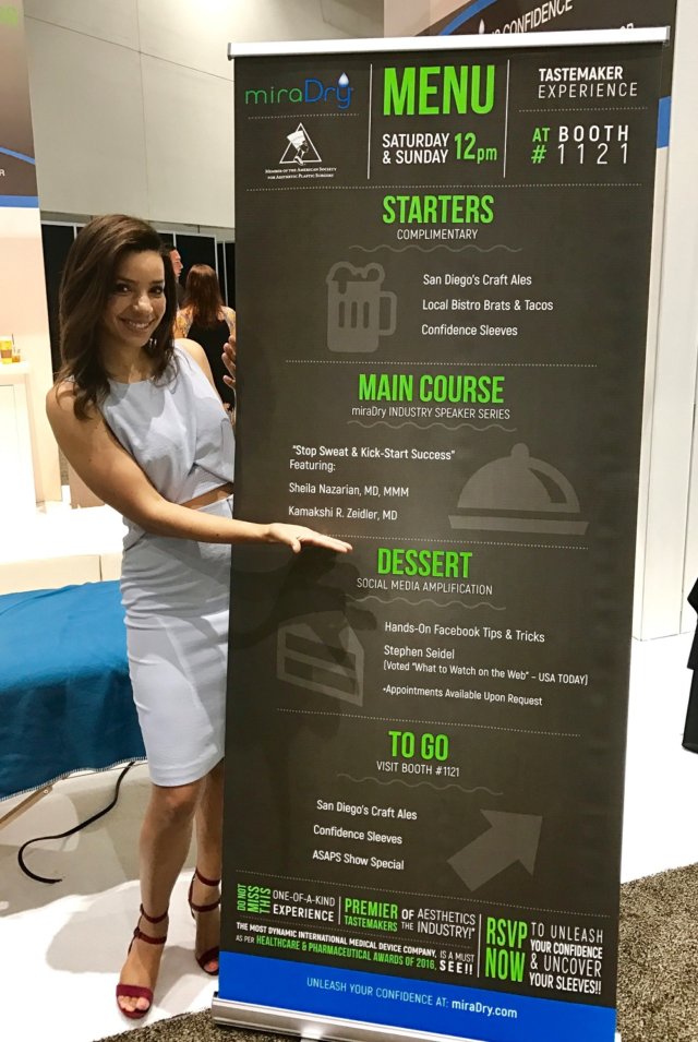 Woman next to banner