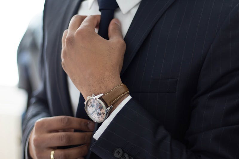 Man fixing his tie