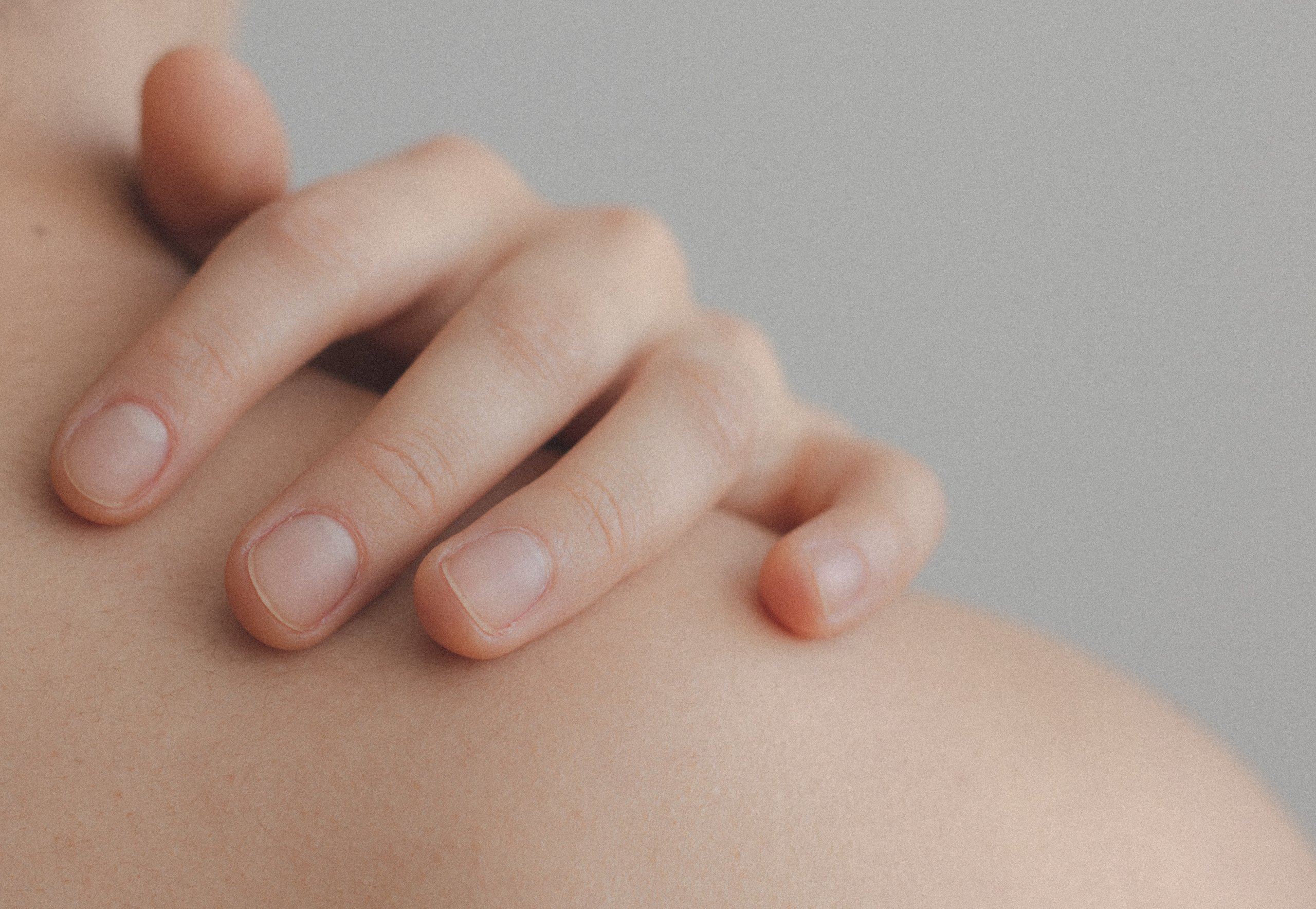 Woman touching her skin