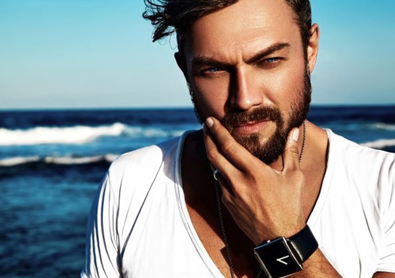 Man touching his beard