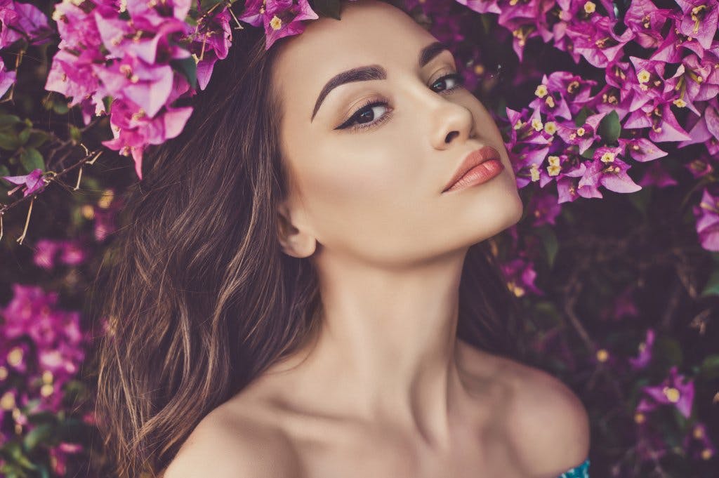 Woman around a bunch of flowers