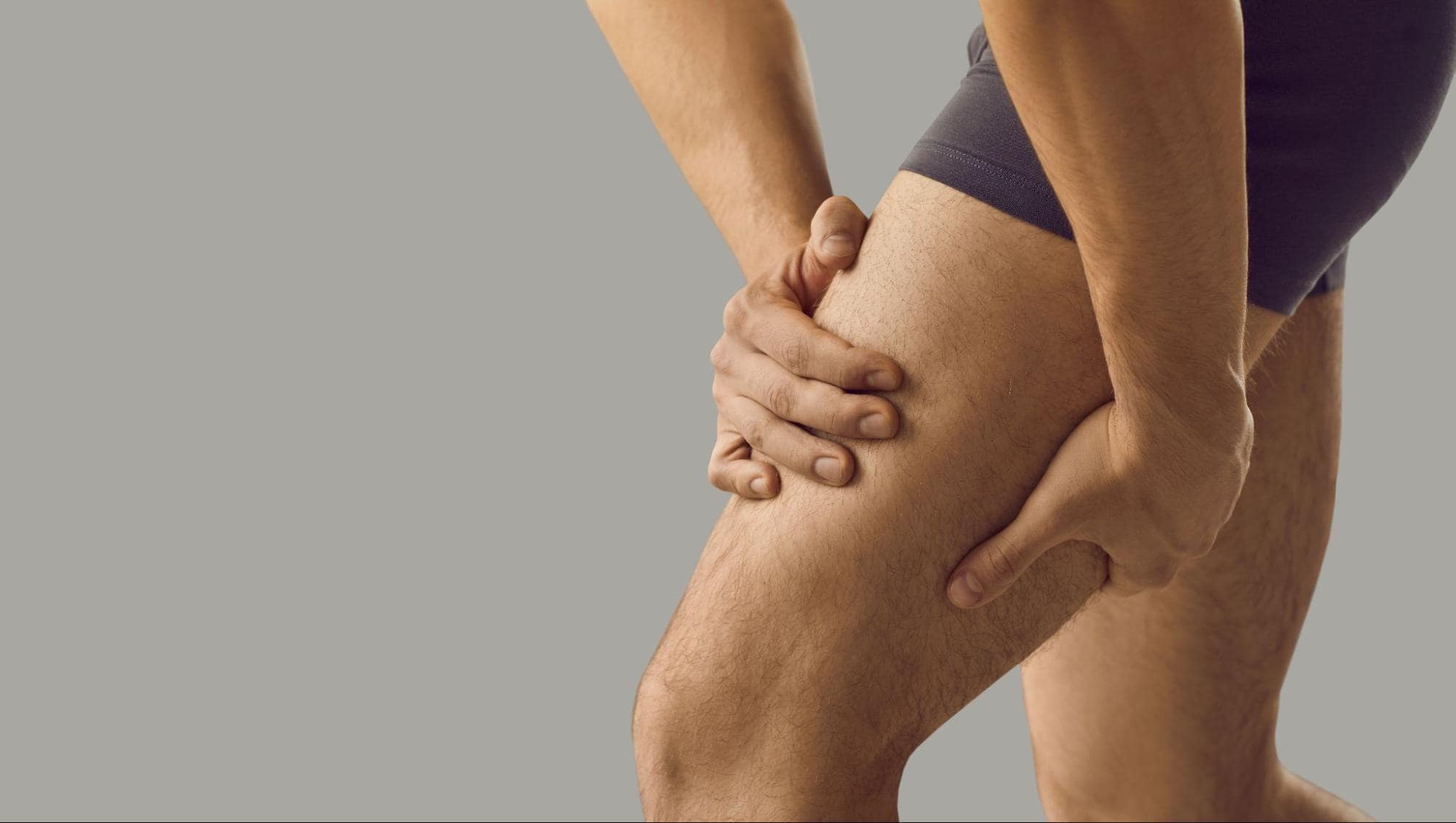 Person touching their leg